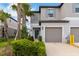 Charming townhome with a well-maintained front yard and a one car garage at 8305 Crescent Oaks Dr, New Port Richey, FL 34655