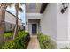 Charming front entrance with well-manicured bushes lining the sidewalk at 8305 Crescent Oaks Dr, New Port Richey, FL 34655