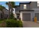 Beautiful two-story home with a two car garage, landscaped yard, and a welcoming entrance at 8305 Crescent Oaks Dr, New Port Richey, FL 34655