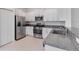 Kitchen featuring stainless steel appliances, granite countertops, and ample cabinetry at 8305 Crescent Oaks Dr, New Port Richey, FL 34655