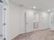 View into the laundry room through a doorway, the appliances are white at 8305 Crescent Oaks Dr, New Port Richey, FL 34655