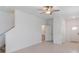 Open-concept space with tile flooring that leads to stairs and a half bathroom at 8305 Crescent Oaks Dr, New Port Richey, FL 34655