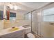 This bathroom features a shower and vanity at 8340 Saint Marks Ct, Hudson, FL 34667