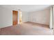 Spacious bedroom features neutral walls and door to attached bathroom at 8340 Saint Marks Ct, Hudson, FL 34667