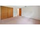 Bedroom features double closet, ample floor space, and neutral walls at 8340 Saint Marks Ct, Hudson, FL 34667