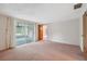 Bright bedroom boasts sliding glass doors leading to the screened-in patio at 8340 Saint Marks Ct, Hudson, FL 34667