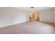 Large, bright living room with neutral walls and ample space for entertaining and relaxing at 8340 Saint Marks Ct, Hudson, FL 34667