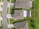 Aerial view of home with screened pool and fenced backyard in a manicured neighborhood at 8938 Bower Bass Cir, Wesley Chapel, FL 33545