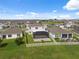 Backyard aerial view with fenced yard and enclosed lanai provides private outdoor living space at 8938 Bower Bass Cir, Wesley Chapel, FL 33545