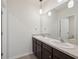 Bathroom featuring a double sink vanity with modern fixtures and neutral paint at 8938 Bower Bass Cir, Wesley Chapel, FL 33545