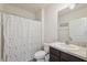 Bathroom featuring toilet, sink with vanity, and shower with patterned curtain at 8938 Bower Bass Cir, Wesley Chapel, FL 33545