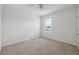 Bright bedroom features carpet, neutral paint, ceiling fan, and a window with blinds at 8938 Bower Bass Cir, Wesley Chapel, FL 33545