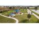 Community park featuring a playground, covered picnic tables, and walking paths for outdoor enjoyment at 8938 Bower Bass Cir, Wesley Chapel, FL 33545