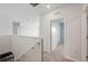 Bright hallway with carpet flooring and white trim at 8938 Bower Bass Cir, Wesley Chapel, FL 33545