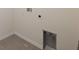 Empty laundry hookups in a well-lit laundry room with tiled floors at 8938 Bower Bass Cir, Wesley Chapel, FL 33545