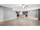 Open concept floor plan shows the living room, kitchen, and stairway in the house at 8938 Bower Bass Cir, Wesley Chapel, FL 33545