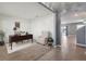 The living room offers an armchair and desk for a perfect home office at 8938 Bower Bass Cir, Wesley Chapel, FL 33545