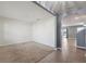 The living room offers an arched doorway and transition into the kitchen at 8938 Bower Bass Cir, Wesley Chapel, FL 33545