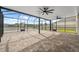 Large screened patio with brick pavers provides a versatile outdoor entertainment area at 8938 Bower Bass Cir, Wesley Chapel, FL 33545