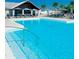 Refreshing community swimming pool and splash-pad for relaxation and fun at 8938 Bower Bass Cir, Wesley Chapel, FL 33545