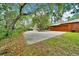 Wide driveway leading to a two-car garage at 9130 Madrid Rd, Weeki Wachee, FL 34613