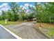 A long paved driveway leads to a charming home at 9130 Madrid Rd, Weeki Wachee, FL 34613