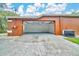 Exterior view of a spacious garage, showcasing access for multiple vehicles at 9130 Madrid Rd, Weeki Wachee, FL 34613