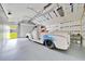 Spacious garage with an antique car at 9130 Madrid Rd, Weeki Wachee, FL 34613
