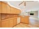 Bright eat-in kitchen features wood cabinets, neutral counters and stainless steel appliances at 9130 Madrid Rd, Weeki Wachee, FL 34613