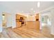 Bright kitchen with stainless steel appliances, hardwood floors, and ceiling fan at 9130 Madrid Rd, Weeki Wachee, FL 34613