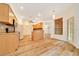 Bright kitchen with stainless steel appliances, hardwood floors, and breakfast bar at 9130 Madrid Rd, Weeki Wachee, FL 34613