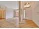 Bright living room with beautiful chandelier, front door and natural light at 9130 Madrid Rd, Weeki Wachee, FL 34613