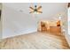 Open living space with lots of light and ceiling fan open to the kitchen with stainless steel appliances at 9130 Madrid Rd, Weeki Wachee, FL 34613