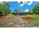 A secluded screened-in pool area set in a green backyard at 9130 Madrid Rd, Weeki Wachee, FL 34613