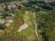 An aerial view showcases a beautiful golf course with lush green fairways and manicured sand traps at 9719 Oakwood Hills Ct, New Port Richey, FL 34655