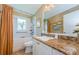 Updated bathroom with tan walls, a tiled floor, and a shower and tub combo at 9719 Oakwood Hills Ct, New Port Richey, FL 34655