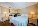 Bedroom with hardwood floors, ceiling fan, and built-in workstation at 9719 Oakwood Hills Ct, New Port Richey, FL 34655