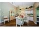 Open dining area showcasing a glass table, elegant chairs, and decorative plant accents at 9719 Oakwood Hills Ct, New Port Richey, FL 34655