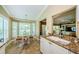 Bright breakfast nook with large windows, perfect for enjoying casual meals and morning coffee at 9719 Oakwood Hills Ct, New Port Richey, FL 34655