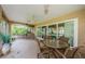 Enjoy the outdoor living space with large seating, ceiling fan, and potted plants at 9719 Oakwood Hills Ct, New Port Richey, FL 34655