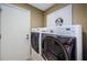 Laundry room area with new washer and dryer and utility closet at 9719 Oakwood Hills Ct, New Port Richey, FL 34655