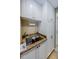 The laundry room has custom cabinets, granite counter, and stainless steel sink at 9719 Oakwood Hills Ct, New Port Richey, FL 34655