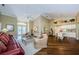 Bright living room boasting high ceilings, a cozy seating area, and an open floor plan at 9719 Oakwood Hills Ct, New Port Richey, FL 34655