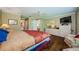 Spacious main bedroom with hardwood floors and ensuite bathroom at 9719 Oakwood Hills Ct, New Port Richey, FL 34655
