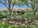Exterior view of the house features a view of the screened patio and well-manicured lawn at 18142 Baywood Forest Dr, Hudson, FL 34667