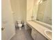 Bathroom with a vanity and toilet at 18142 Baywood Forest Dr, Hudson, FL 34667