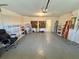 Spacious garage with shelving, ample storage, and access to utilities at 18142 Baywood Forest Dr, Hudson, FL 34667