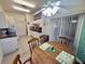 Bright kitchen with breakfast nook, white appliances, and sliding glass door to the lanai at 18142 Baywood Forest Dr, Hudson, FL 34667