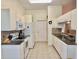 Kitchen with white cabinets, granite countertops, tile backsplash, and ample counter space at 18142 Baywood Forest Dr, Hudson, FL 34667