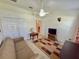 This living room has great natural light from the windows and carpet at 18142 Baywood Forest Dr, Hudson, FL 34667